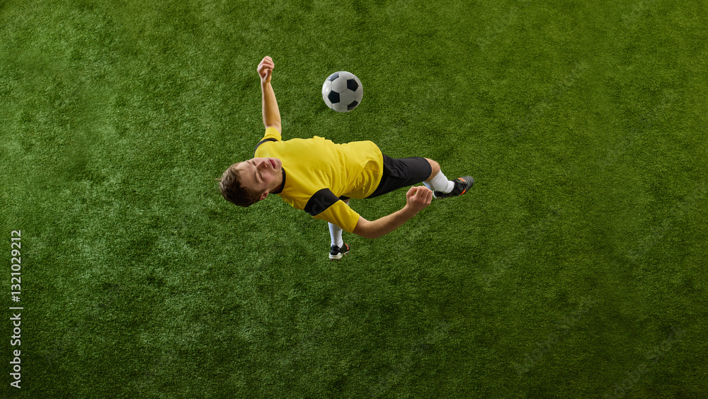 Top view dynamic image of determined young man, soccer player in motion on green stadium, kicking ball with chest, playing. Concept of sport, action, competition, game, active lifestyle. Ads Top view dynamic image of determined young man, soccer player in motion on green stadium, kicking ball with chest, playing. Concept of sport, action, competition, game, active lifestyle. Ads