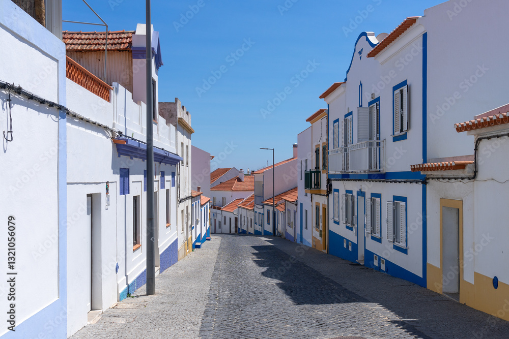 Obraz premium Street of the beautiful fishing village of Vilanova de Milfontes in the Alentejo region of Portugal in a sunny day.