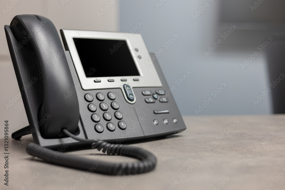 close up telephone VOIP technology standing on office desk in office room for network operation center job concept close up telephone VOIP technology standing on office desk in office room for network operation center job concept