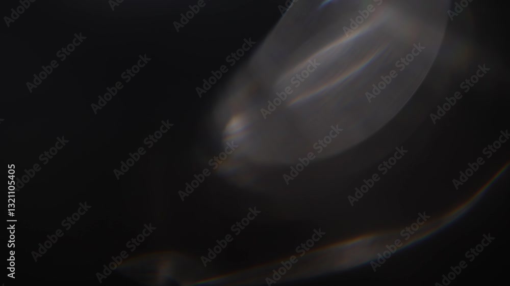 Optical glow lens flare bokeh transition overlays background. White lens flares Light Leak overlay on black background. Spherical Optical Light abstract background. Light Leaks footage