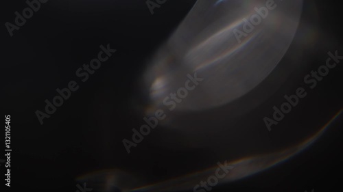 Optical glow lens flare bokeh transition overlays background. White lens flares Light Leak overlay on black background. Spherical Optical Light abstract background. Light Leaks footage