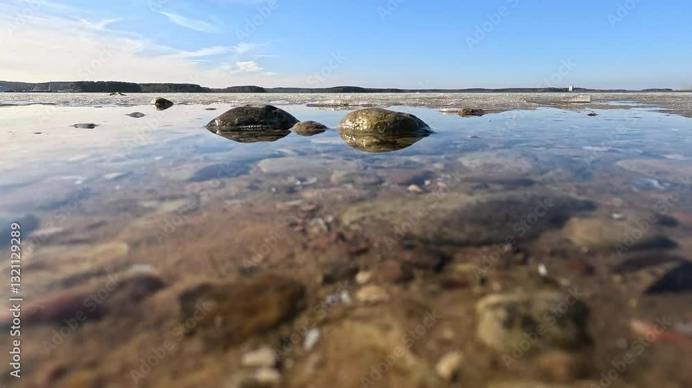 Spring day on the lake, ice floats on the water, transparent water and bottom. Spring day on the lake, ice floats on the water, transparent water and bottom.