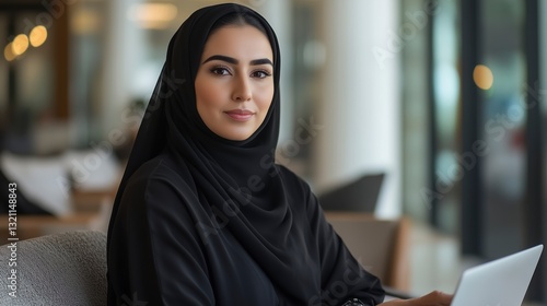Elegant Arab Woman in a Stylish Abaya and Hijab, Working on Laptop in a Minimalist Cafe, Holding a Coffee Cup, Soft Natural Light, Sophisticated Modern Atmosphere