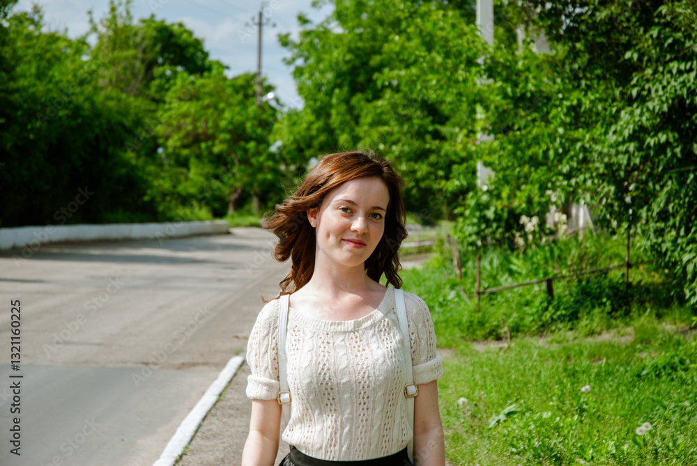 Young caucasian woman smiling outdoors on sunny day Young caucasian woman smiling outdoors on sunny day