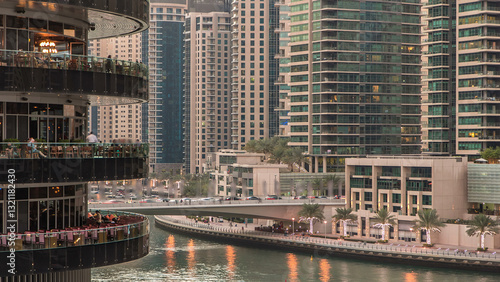 Canvas Print Dubai Marina towers and canal in Dubai day to night timelapse