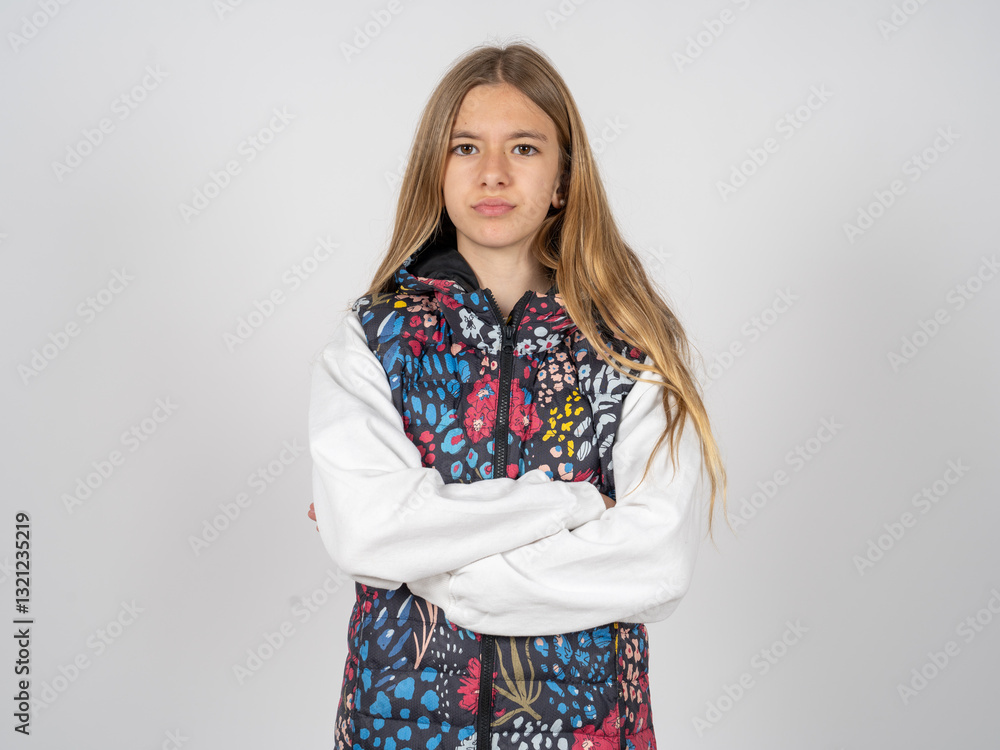 beautiful teen girl wearing colorful vest Pointing down with fingers showing advertisement, surprised face and open mouth beautiful teen girl wearing colorful vest Pointing down with fingers showing advertisement, surprised face and open mouth