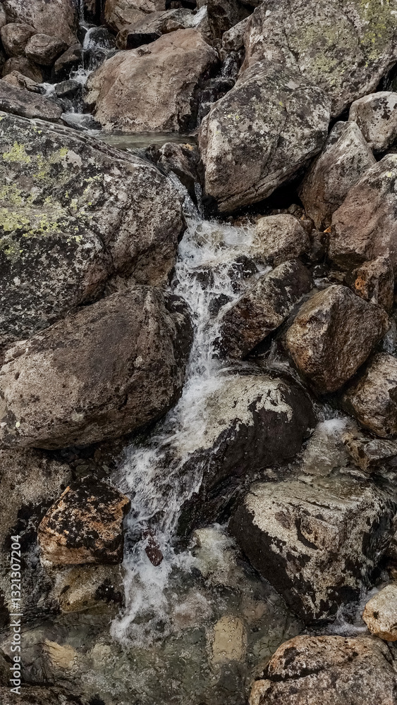 Water flowing down rocks in high tatras mountains, slovakia Water flowing down rocks in high tatras mountains, slovakia