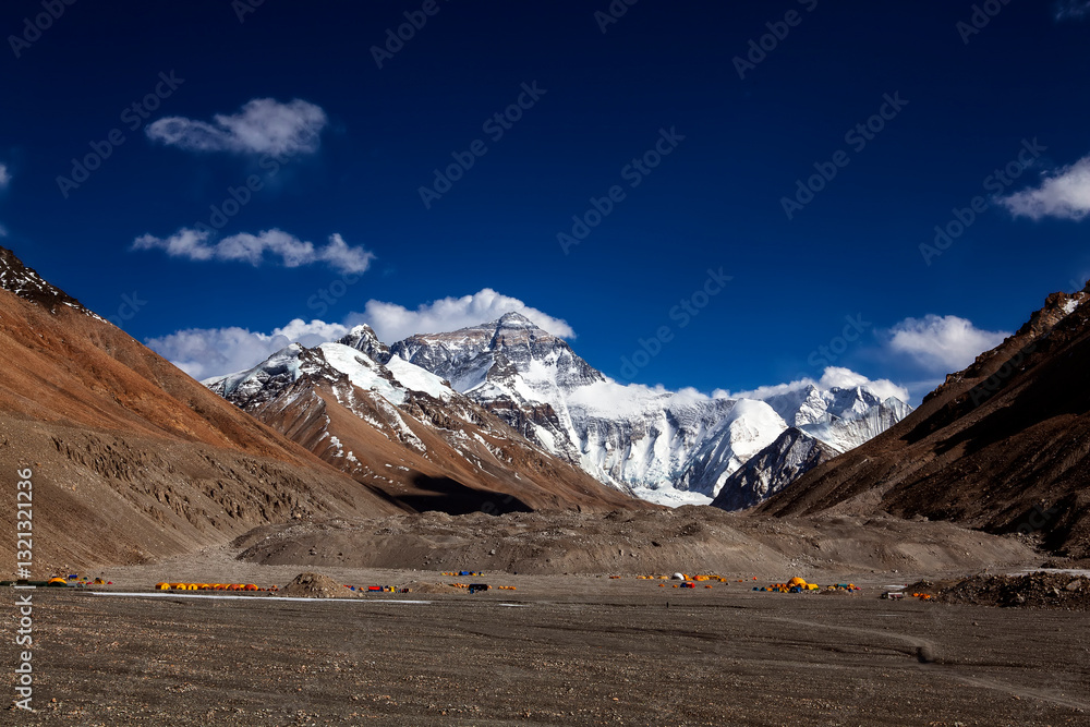 Fototapeta premium Breathtaking view of Mount Everest’s summit merging with the clouds, captured from Tibet. The world’s highest peak stands majestically, showcasing its grandeur and power