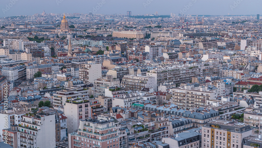 Aerial panorama above houses rooftops in a Paris day to night timelapse Aerial panorama above houses rooftops in a Paris day to night timelapse