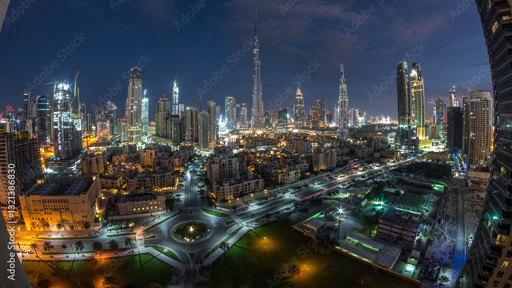 Fototapeta premium Dubai Downtown skyline night to day timelapse with Burj Khalifa and other towers panoramic view from the top in Dubai