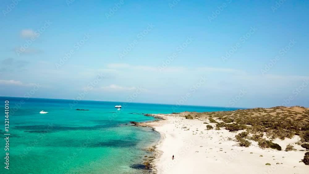 Stunning Aerial Drone Flight Over Chrysi Island, Crete, Showcasing White Sand Beaches, Turquoise Waters, and Breathtaking Mediterranean Coastal Views Stunning Aerial Drone Flight Over Chrysi Island, Crete, Showcasing White Sand Beaches, Turquoise Waters, and Breathtaking Mediterranean Coastal Views