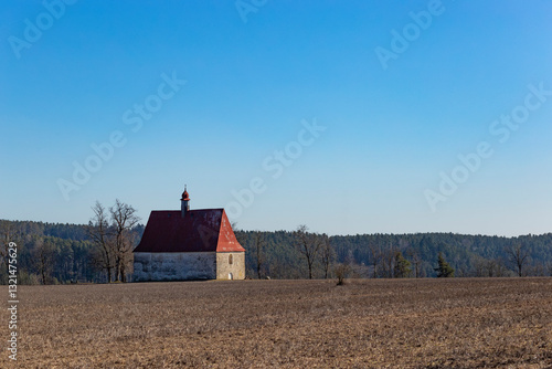 Obraz na płótnie Old church in the field. Dobronice u Bechyne, Czechia w salonie