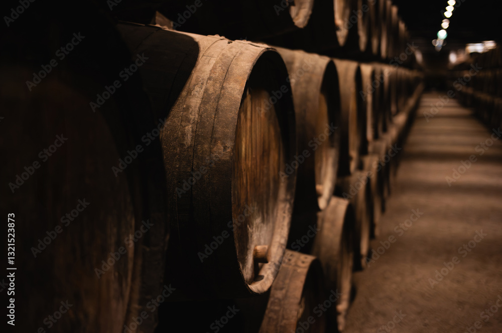 Closeup of Traditional Oak Wine Barrels in a Cellar Closeup of Traditional Oak Wine Barrels in a Cellar