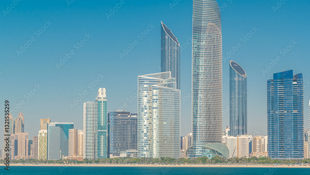Obraz premium View of high skyscrapers on a corniche in Abu Dhabi stretching alongside the business center timelapse hyperlapse.