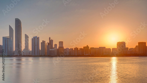 Wallpaper Mural Abu Dhabi city skyline on sunrise time with water reflection timelapse. Torontodigital.ca