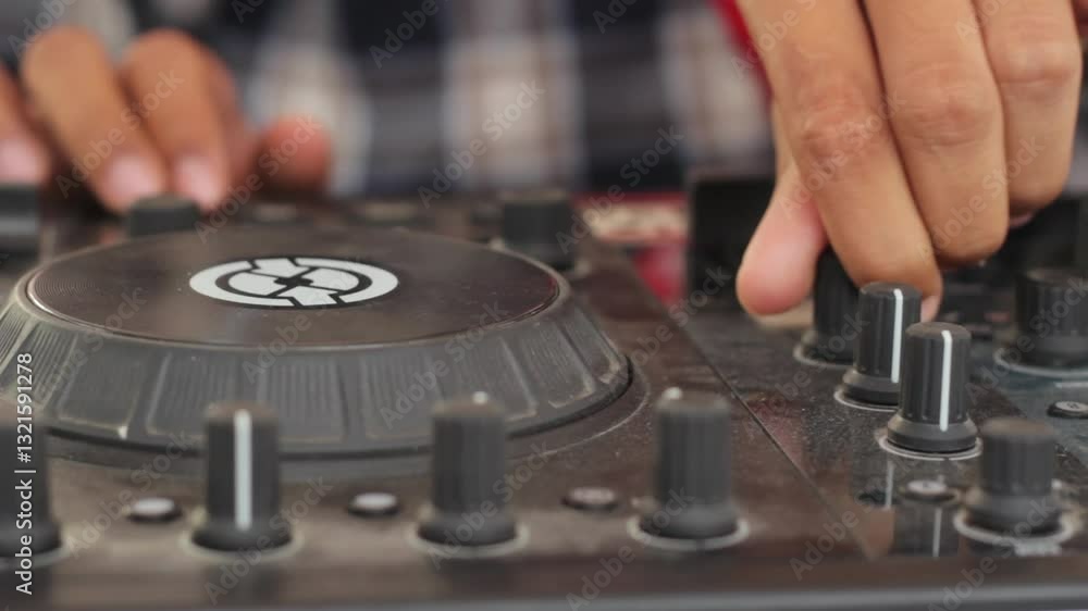 Close up of DJ hands controlling a music table Close up of DJ hands controlling a music table