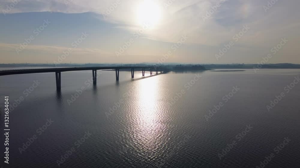 4k aerial video of a highway bridge in Denmark with a sun in the background. 4k aerial video of a highway bridge in Denmark with a sun in the background.