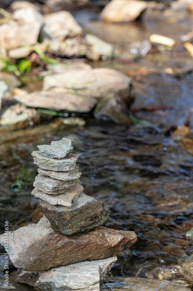 Balance stones in a stream in spring spiritual relaxation vertical