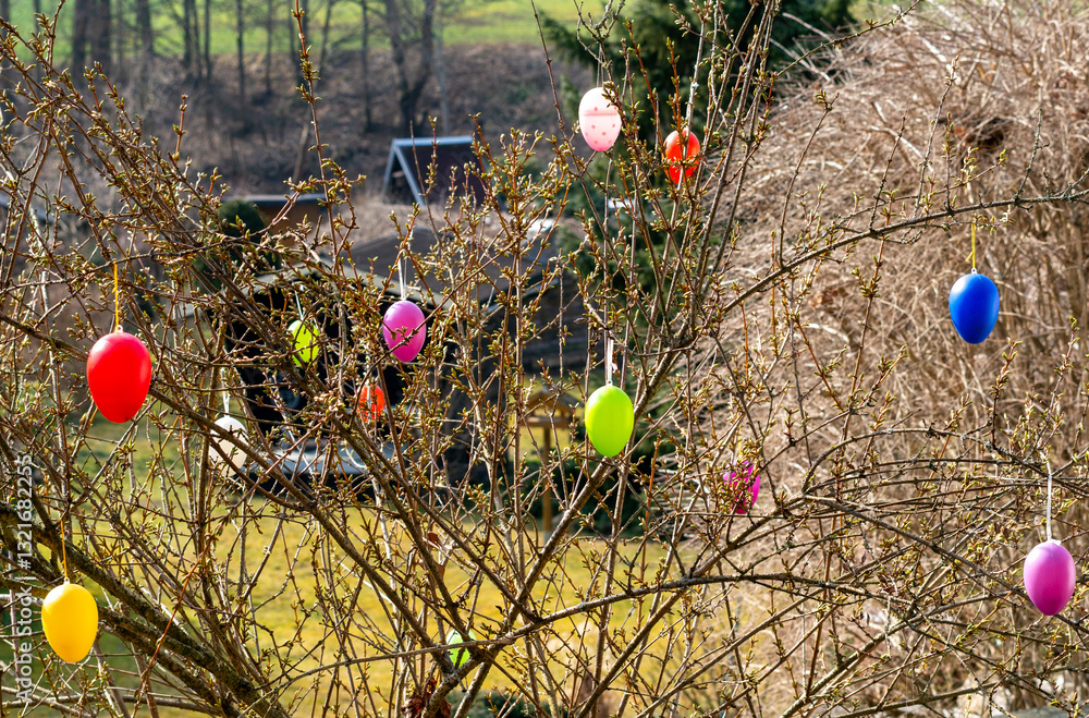 Colorful Easter eggs move on a bush in spring 4k