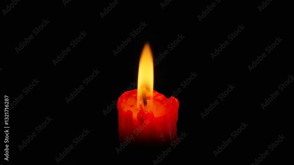 Lit red candle on black background. Horizontal video. Lit red candle on black background. Horizontal video.