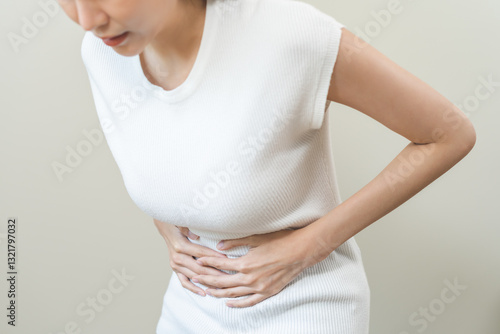 Wallpaper Mural Flatulence asian young woman intolerance hand in stomach ache, suffer from food poisoning, abdominal pain and colon problem, gastritis or diarrhoea when at home. Patient belly, abdomen or inflammation Torontodigital.ca