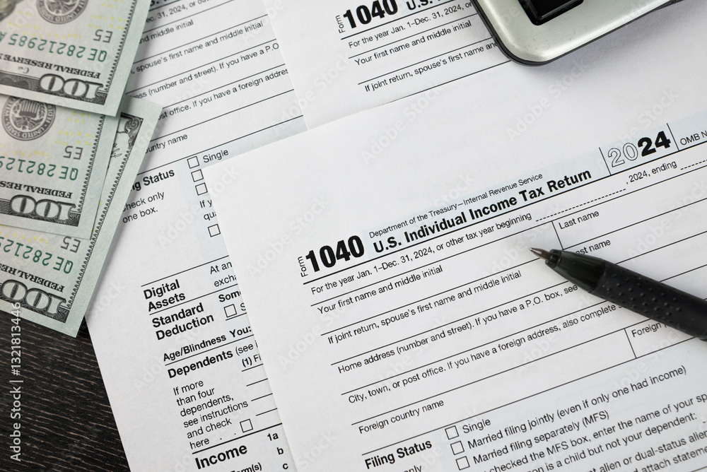 Obraz premium Tax form 1040 on dark wooden background, financial document.