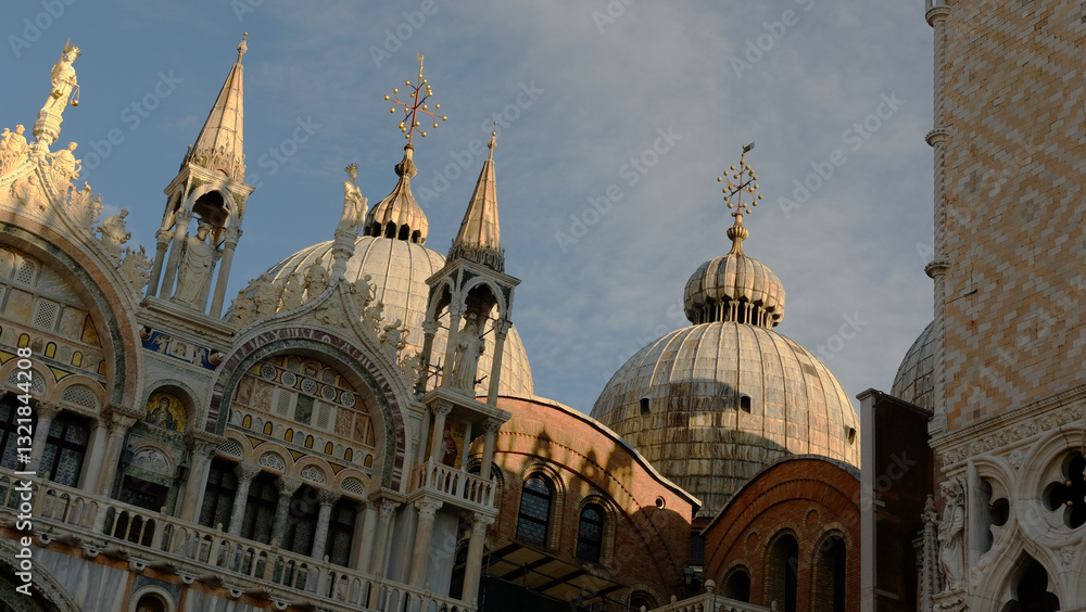 Fototapeta premium Stunning architectural details of St. Mark's Basilica in Venice during golden hour