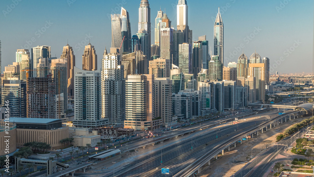 Fototapeta premium Dubai Marina towers during sunset aerial timelapse, United Arab Emirates