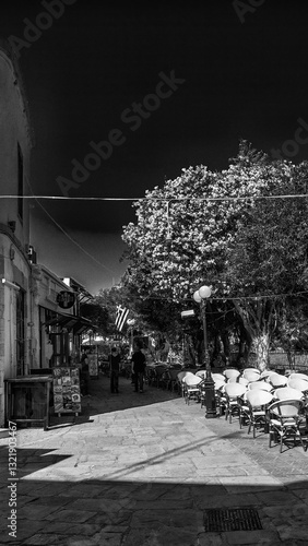 Obraz na płótnie Kos, Greece - June 5, 2014: Charming streets of Kos on a bright sunny day with traditional architecture w salonie