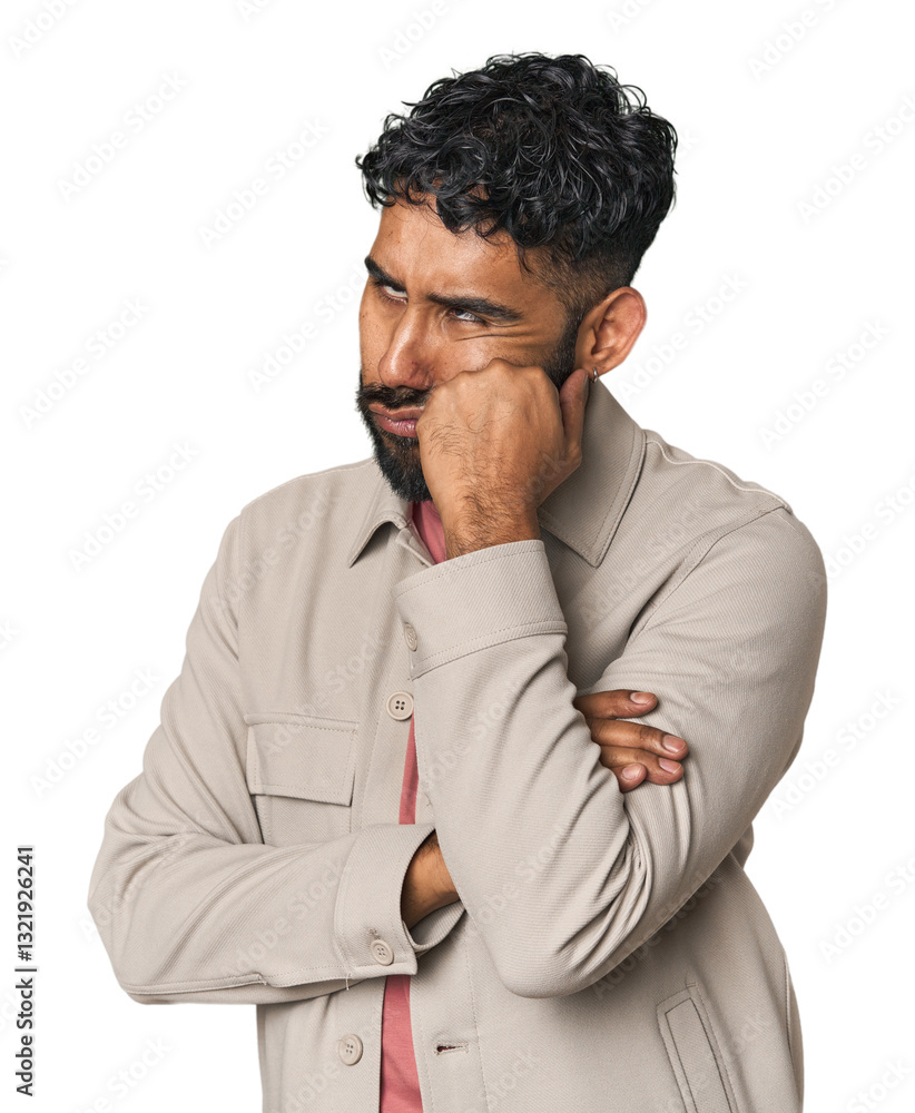 Young Hispanic man isolated who feels sad and pensive, looking at copy space. Young Hispanic man isolated who feels sad and pensive, looking at copy space.