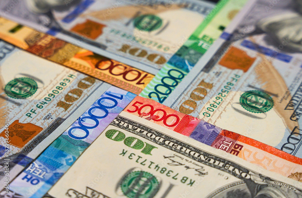 Dollars laid out in a cross in tenge