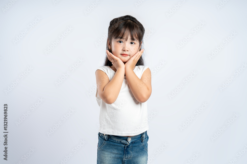 Portrait of beautiful Asian girl posing on white background, child Portrait of beautiful Asian girl posing on white background, child