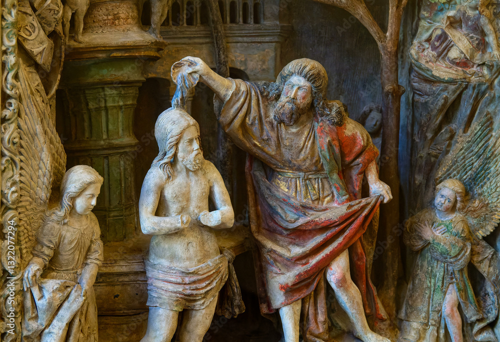 Fototapeta premium Stone bas relief (15th century) of Baptism of Jesus by John the Baptist.