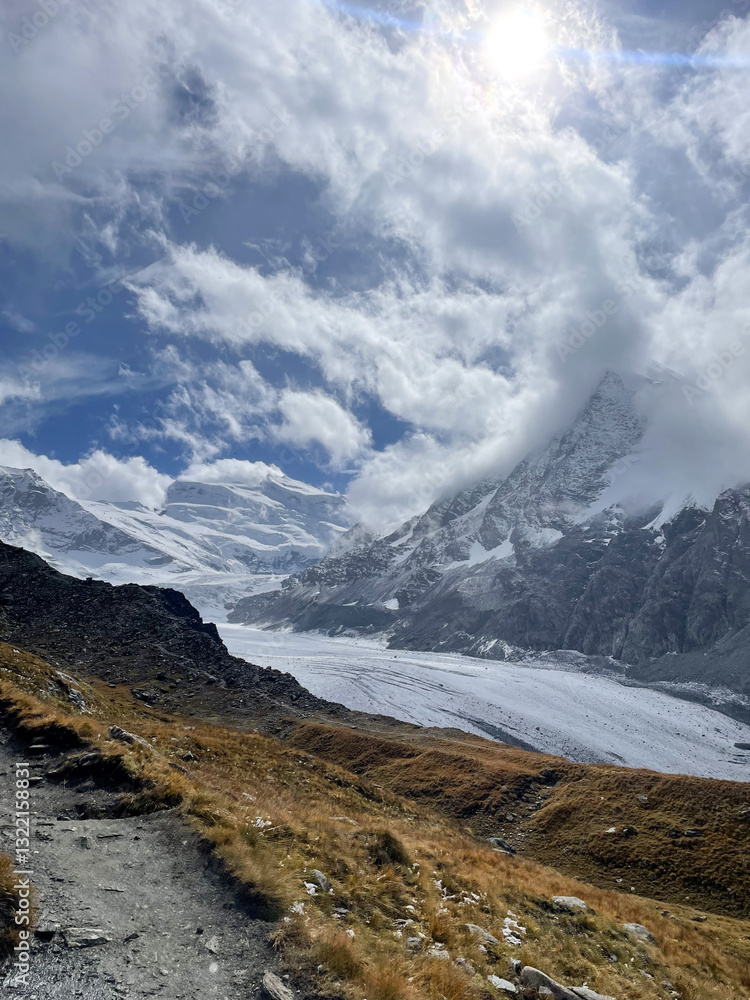 Cloudy mountain landscape in the mountains with a view on a glacier in fall