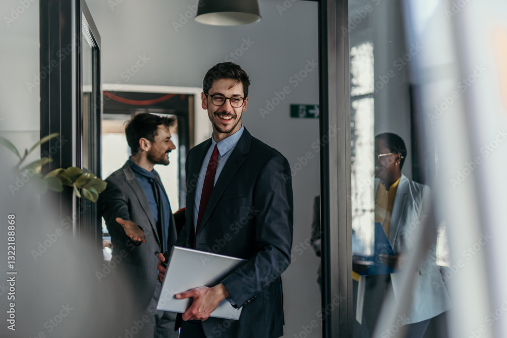 Group of businesspeople in formal attire discussing financial reports Group of businesspeople in formal attire discussing financial reports