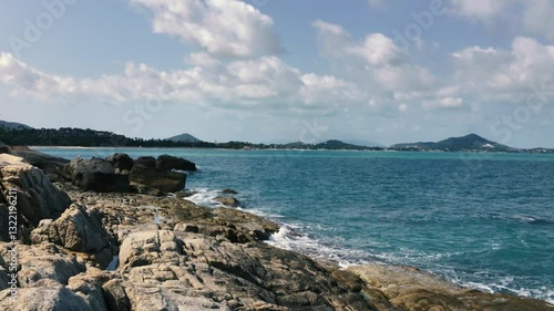 The waves of the Gulf of Thailand are beating against the rocks