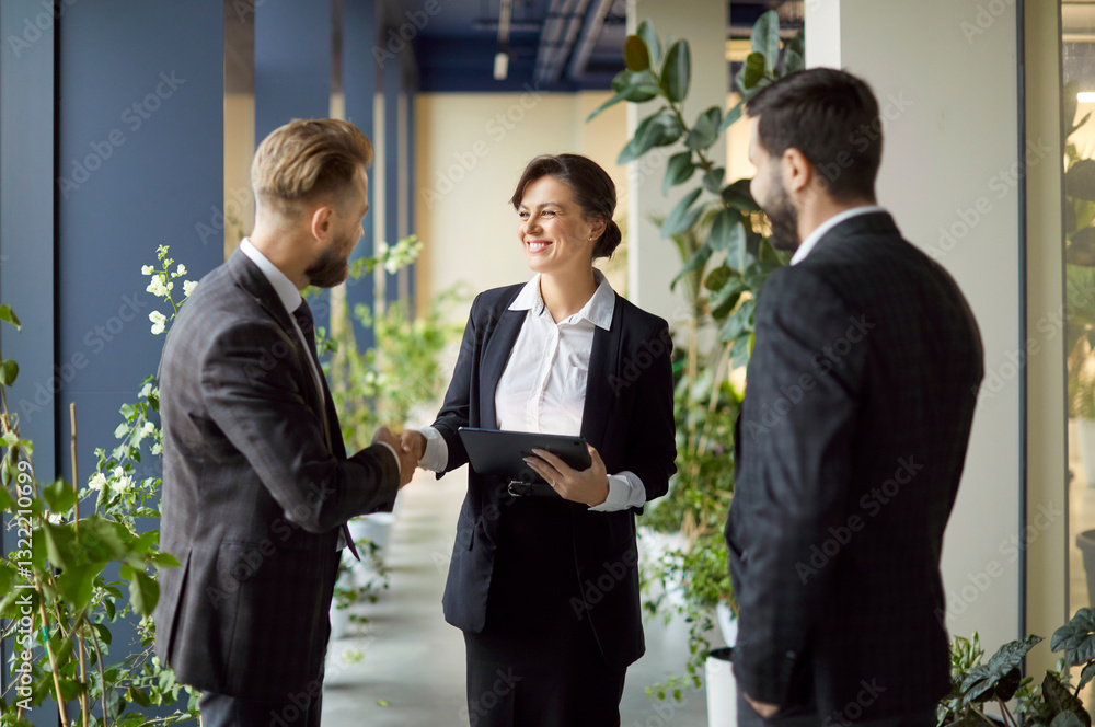 Company of corporate men and woman coworkers shaking hands during meeting, closing successful deal, reach agreement, posing at modern office space. Partnership teamwork and business concept Company of corporate men and woman coworkers shaking hands during meeting, closing successful deal, reach agreement, posing at modern office space. Partnership teamwork and business concept