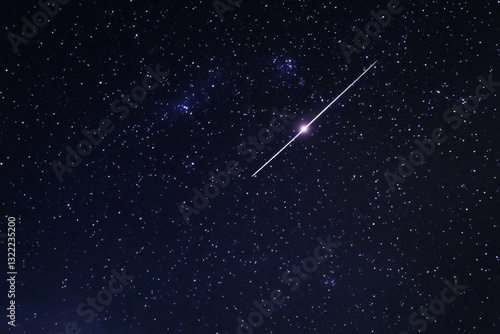 Starry sky with a shooting star trail for galaxy exploration, cosmic fantasies, educational materials about space and constellations on night sky background.
