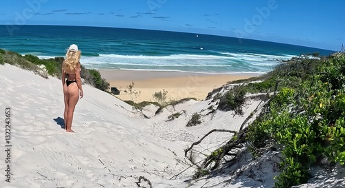 young woman walking on the beach