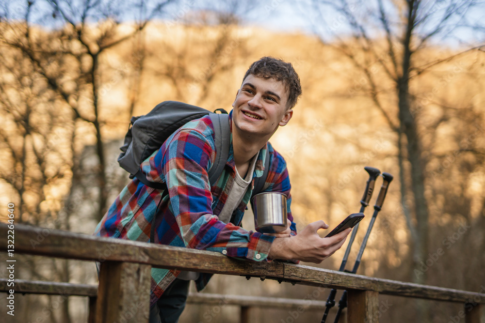 man hiker use cellphone and drink coffee take break from hiking man hiker use cellphone and drink coffee take break from hiking