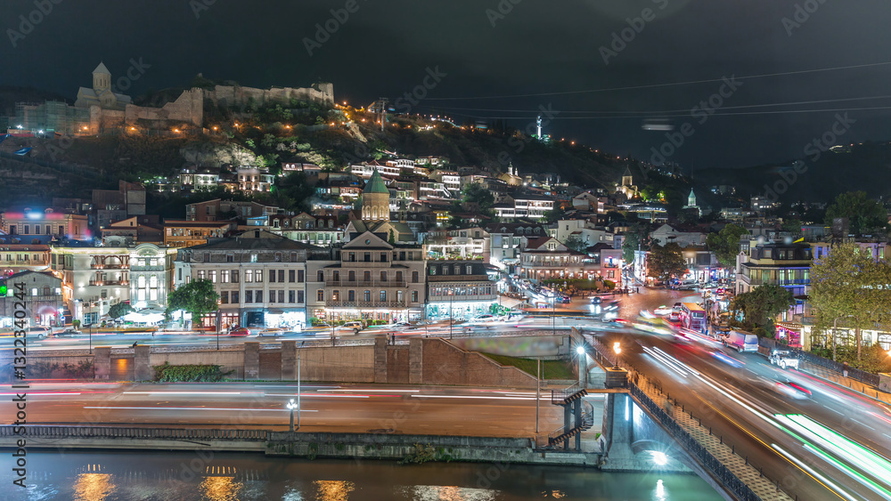 Fototapeta premium Colorful traditional houses with wooden carved balconies in the Old Town of Tbilisi aerial timelapse, Georgia.