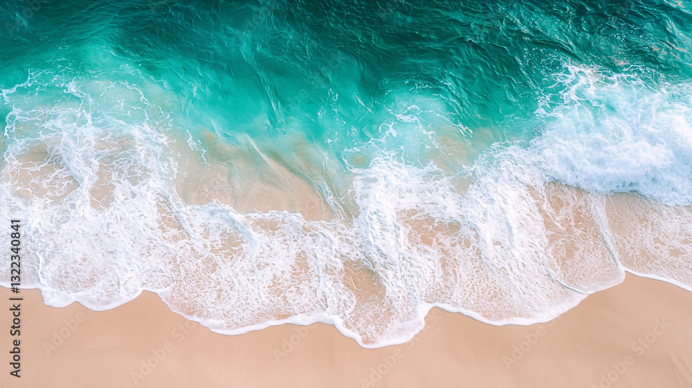 Obraz premium Stunning aerial view of turquoise ocean waves crashing on sandy beach sea foam blue calm water coast