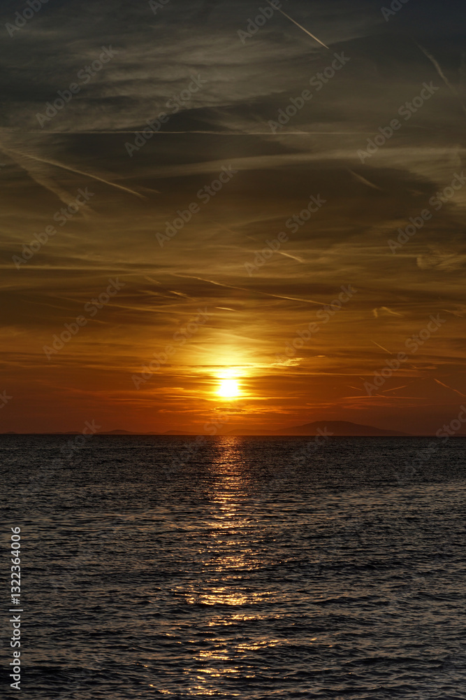 Dusk sunset above wavy sea with astonishing fiery sky above Dusk sunset above wavy sea with astonishing fiery sky above