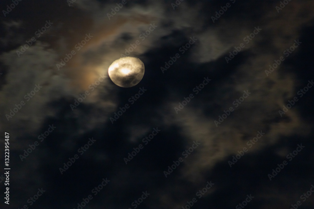 Full moon in the dark night sky with clouds, nature background. Full moon in the dark night sky with clouds, nature background.