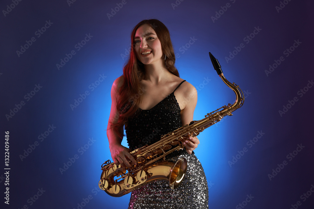 Naklejka premium Professional musician with saxophone on color background