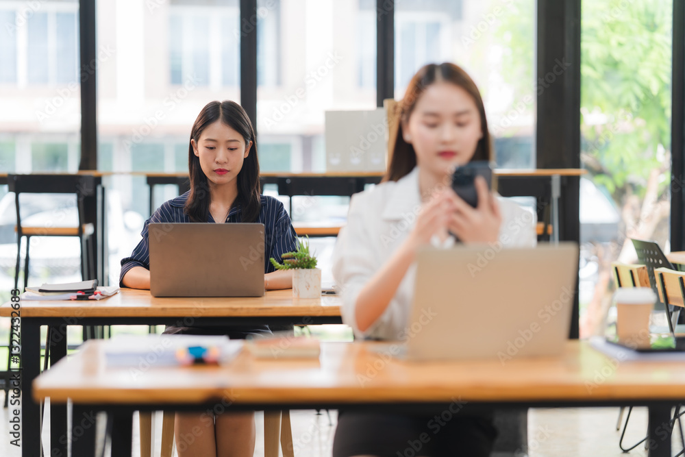 Two Women Working in Modern Office Space Two Women Working in Modern Office Space