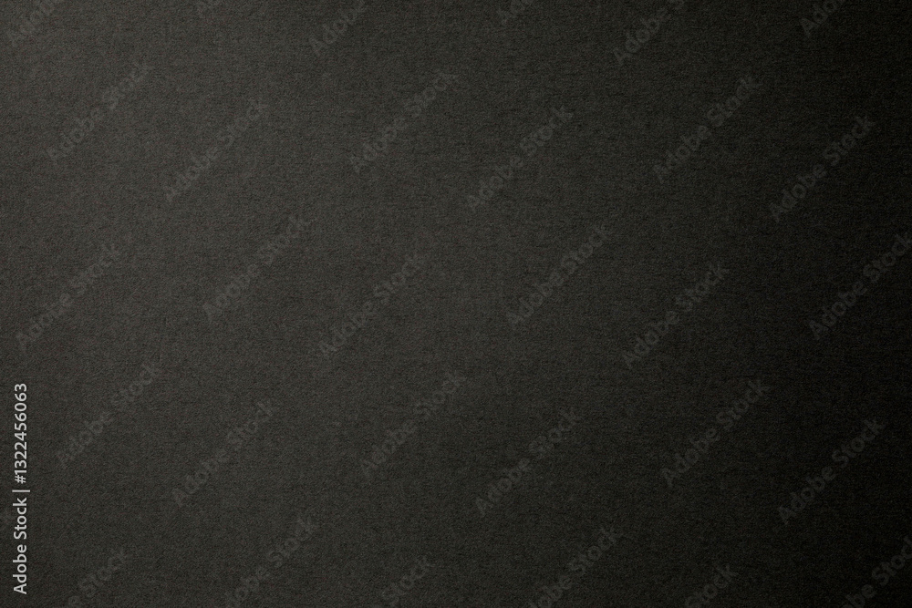 Black paper surface with grainy texture Black paper surface with grainy texture