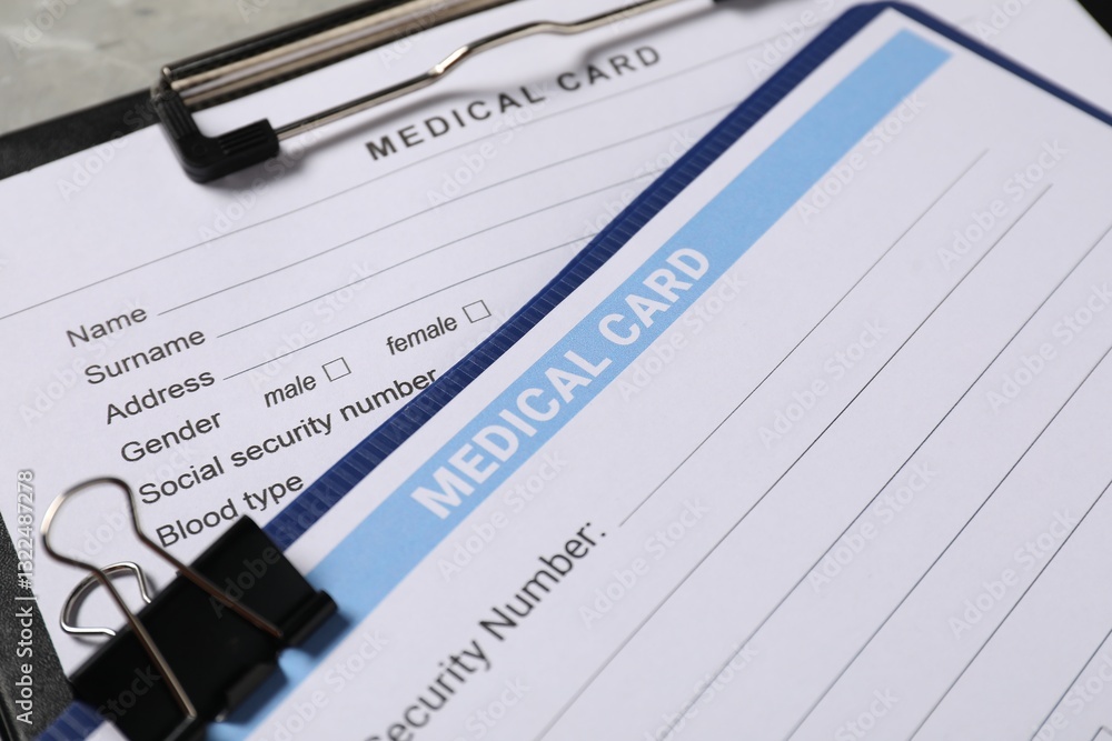 Medical card forms on grey background, closeup Medical card forms on grey background, closeup