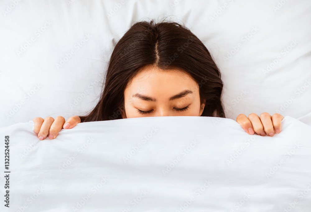 Korean Girl Sleeping Covered With Blanket In Bed At Home, Lying With Eyes Closed. Top-View Korean Girl Sleeping Covered With Blanket In Bed At Home, Lying With Eyes Closed. Top-View