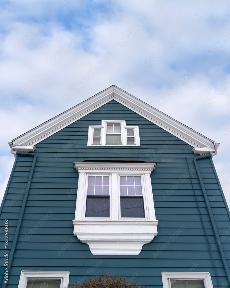 Elegant gable-end house with deep blue-green horizontal siding in Brighton, Massachusetts, USA
Elegant gable-end house with deep blue-green horizontal siding in Brighton, Massachusetts, USA